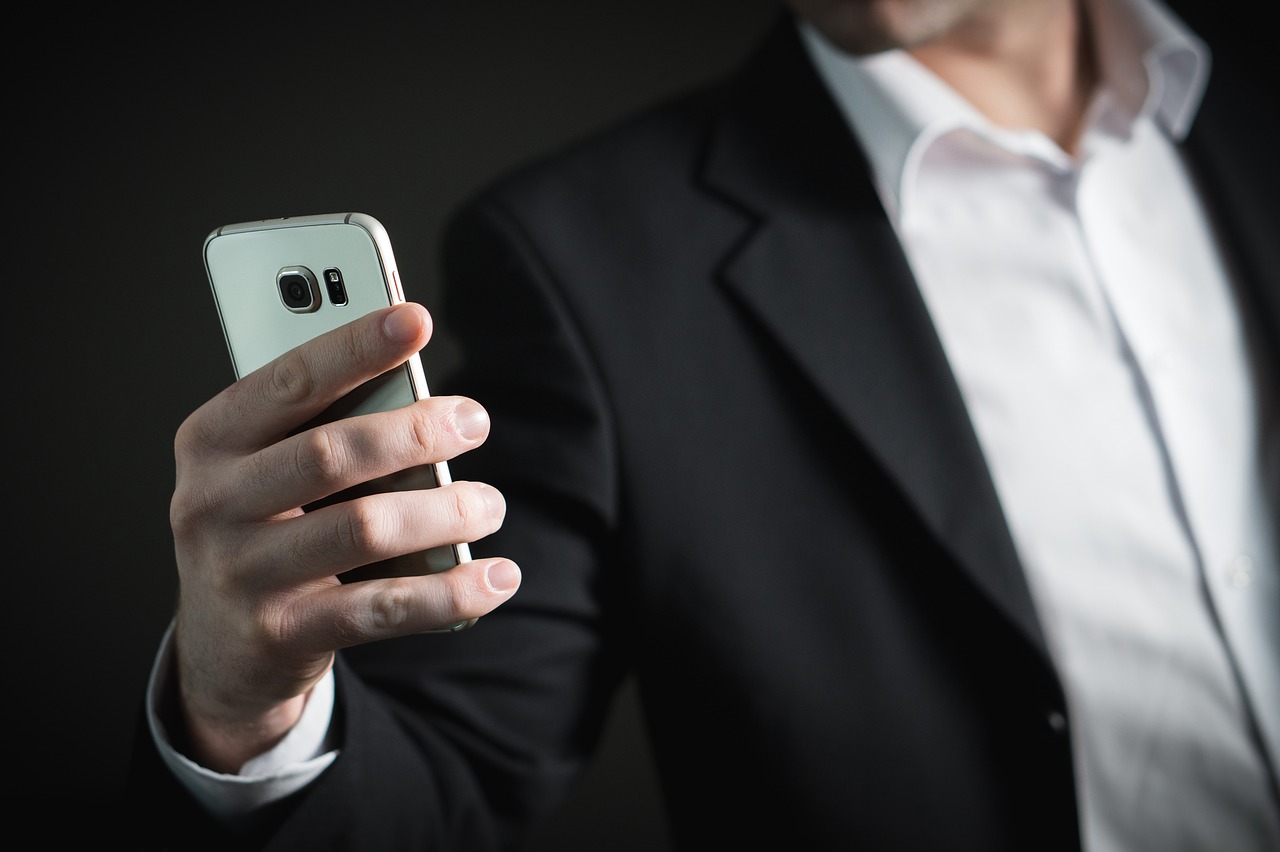A man holding a phone towards him