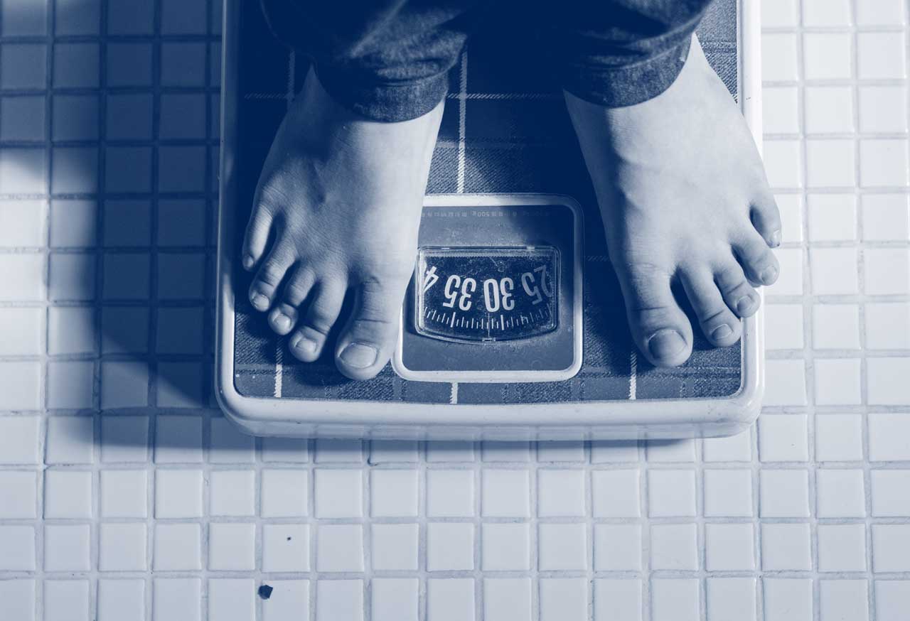 checking weight loss on the scales